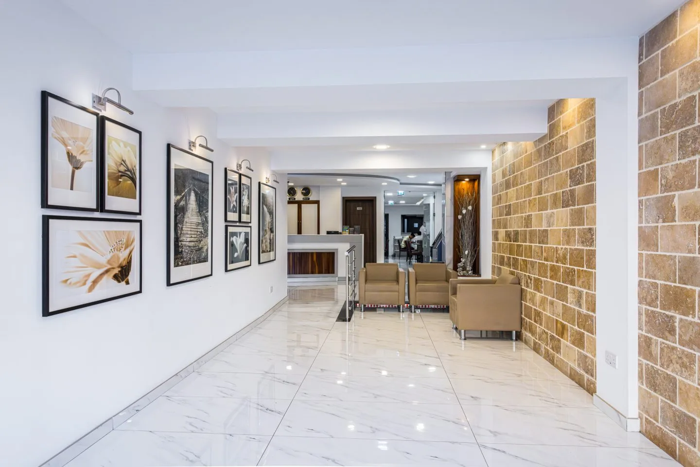 The lobby corridor leading to reception at Cerviola Hotel