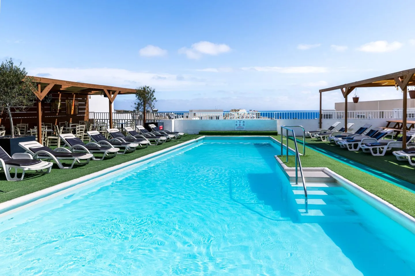 The rooftop pool and sea view at Cerviola Hotel